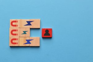 Wooden cubes with magnet icons pull a person in a row blocks. Recruiting and search talent workers
